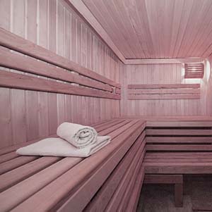 woman relaxing in a sauna at a Mercury spa